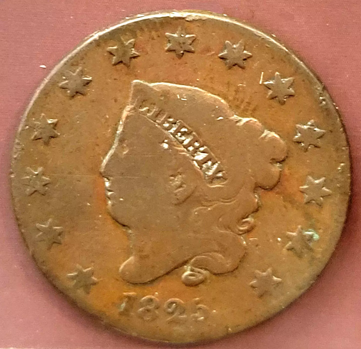 Photo of a worn US Liberty large cent from 1825