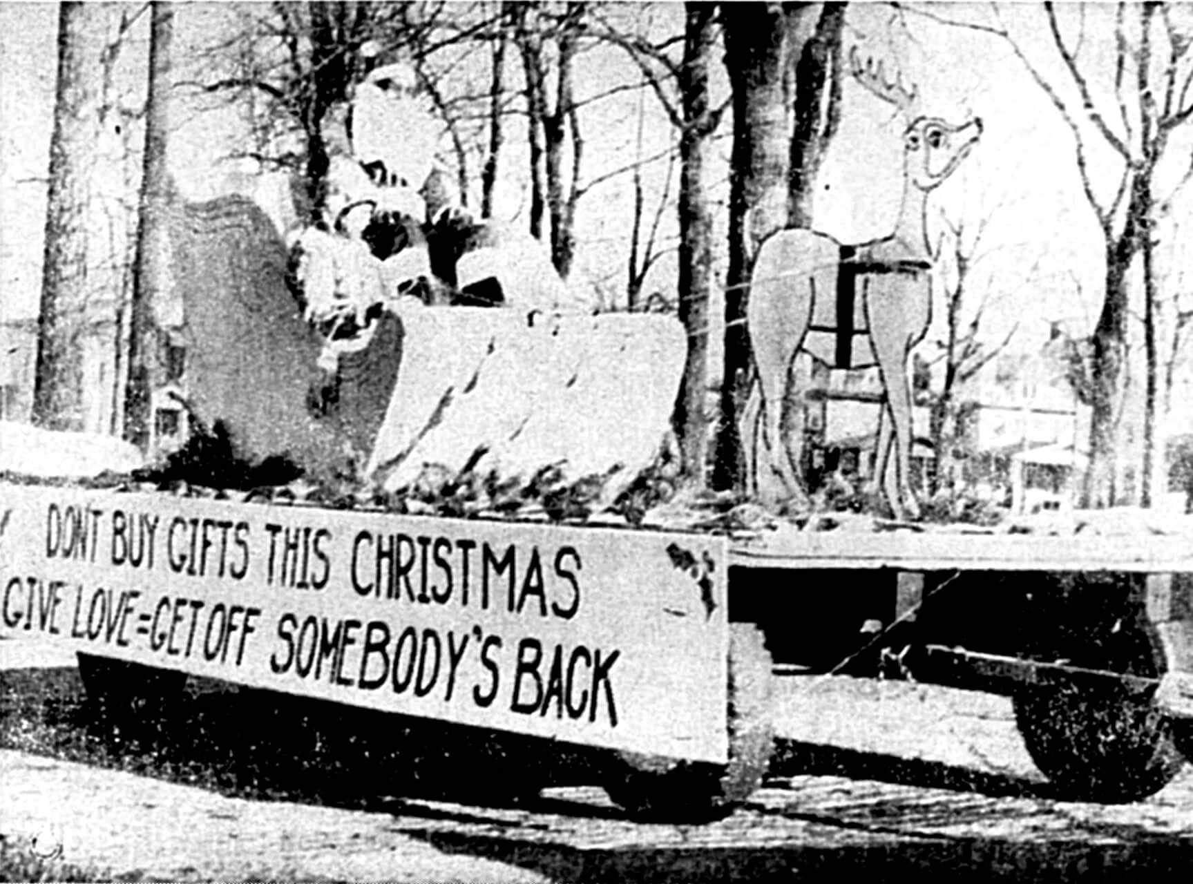 The NAACP’s 1966 float featured Santa Claus (Merlin Kennedy) in a sled and with a sign that read “Don’t Buy Gifts This Christmas, Give Love = Get off Somebody’s Back