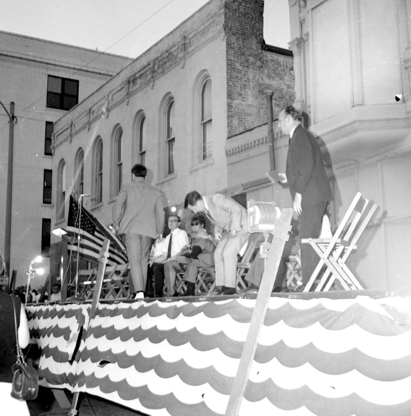 Black and white photo of Mayor Charles Baugh, and state representatives Gerald Bradley and Harber Hall on a stage after speaking in a rally sponsored by concerned citizens.