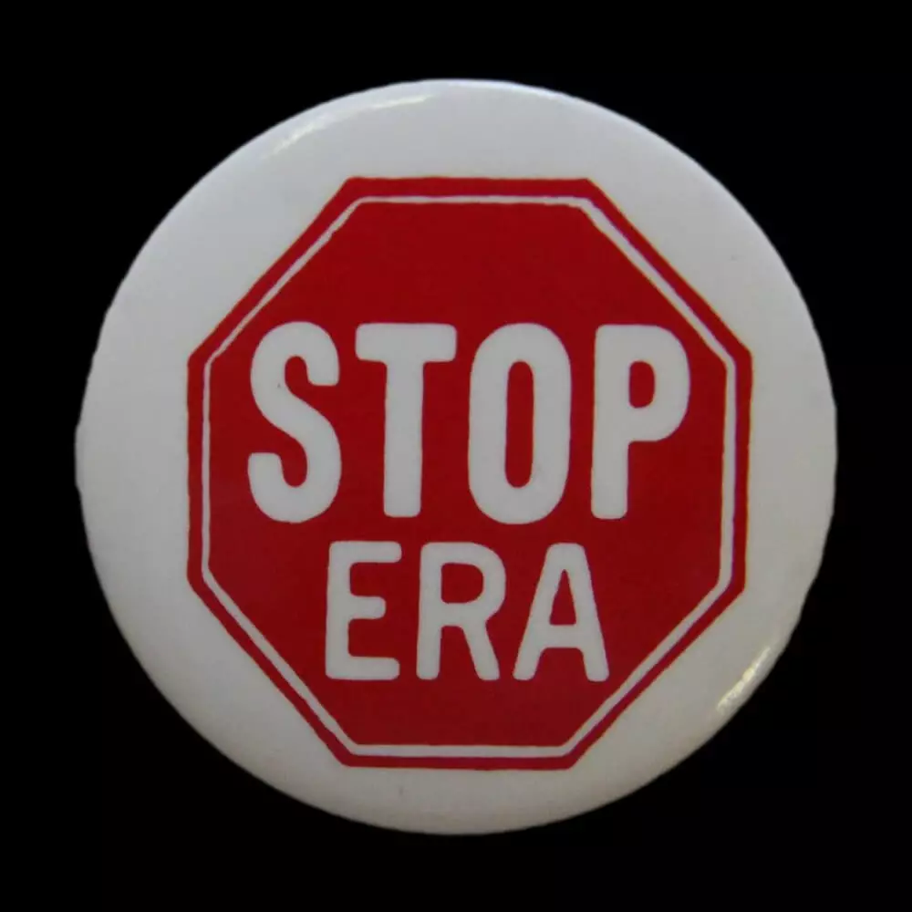 Pinback button with with a red stop sign and STOP ERA in white lettering