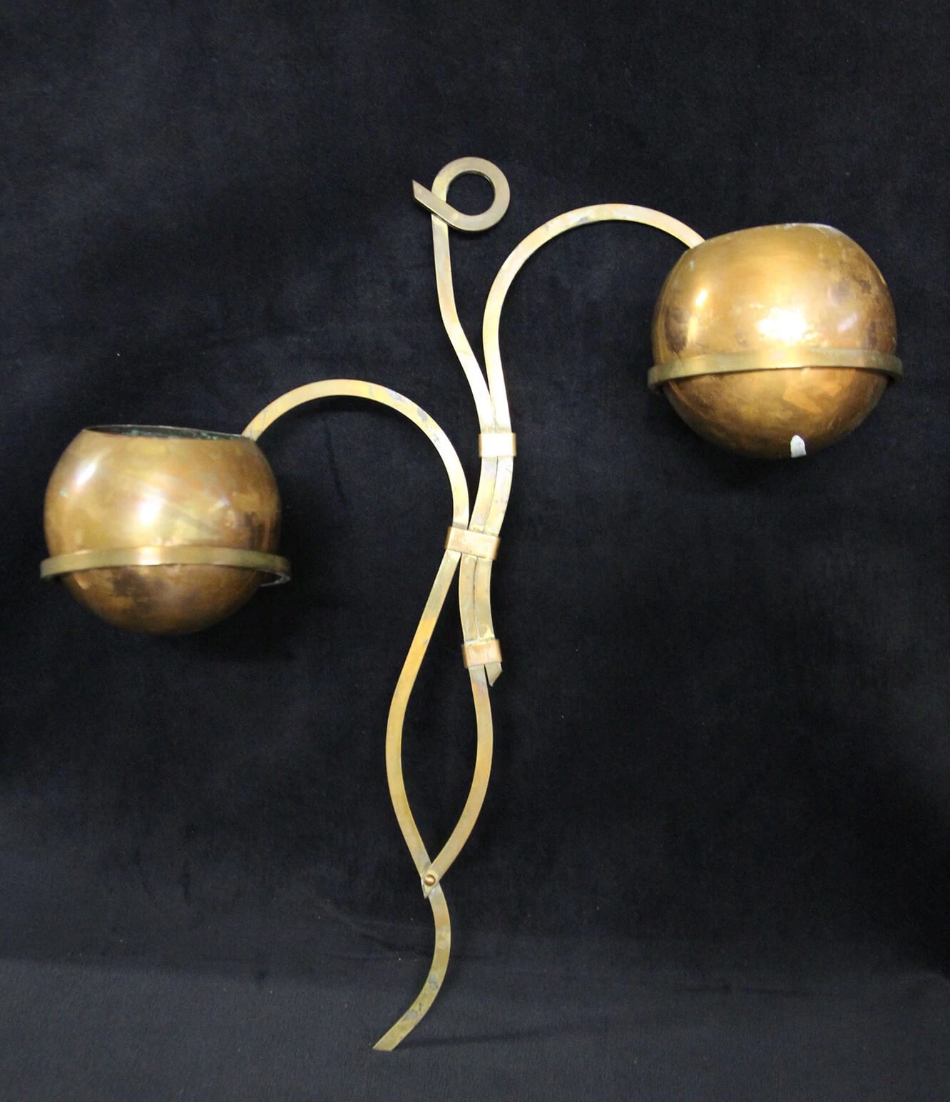 Photo of a decorative wall planter, with copper spheres on a plant-stem inspired rod