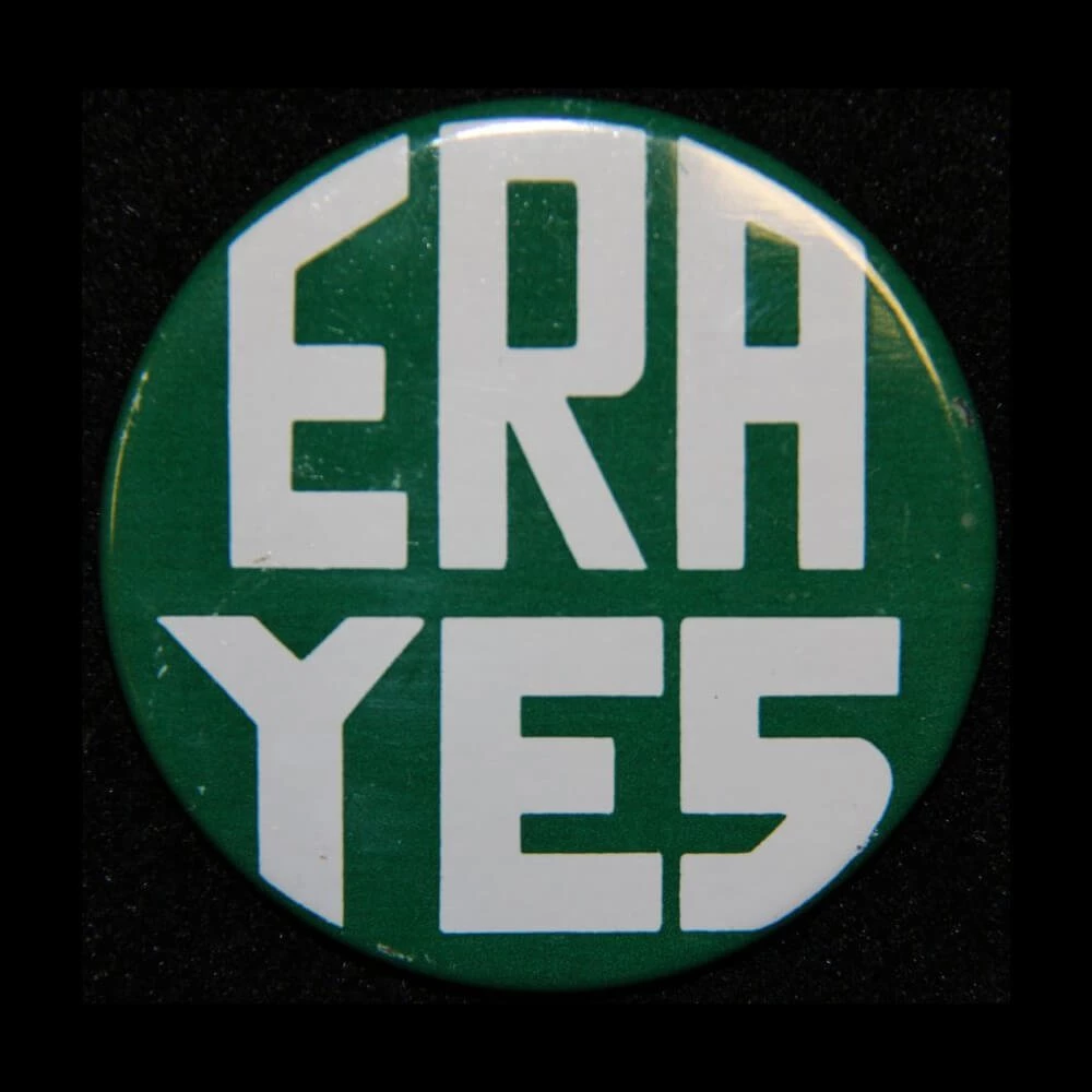 Campaign button with ERA YES in capital letters. Background is green.