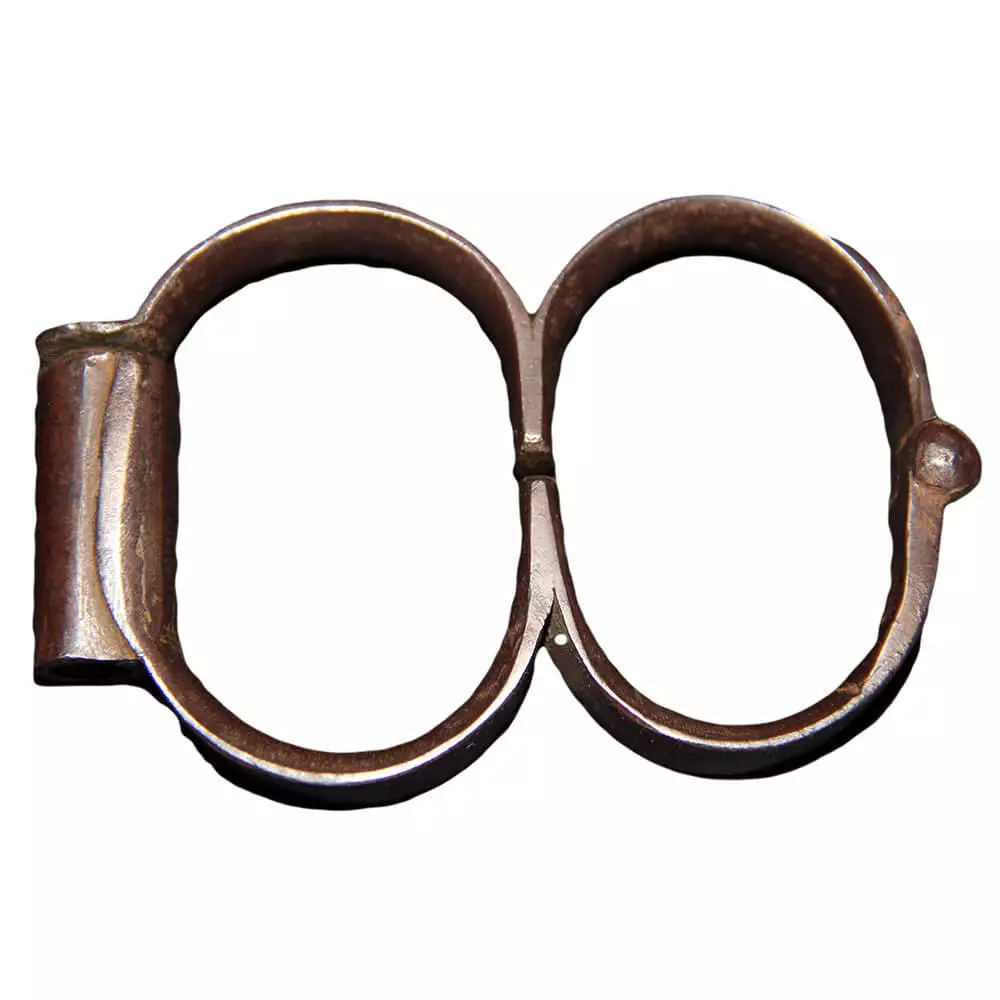 A pair of iron handcuffs with side bar to lock
