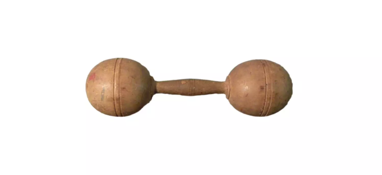 Wooden handle in between two wooden spheres.