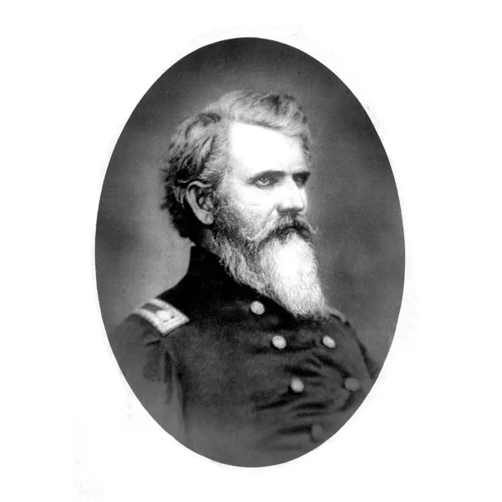 Black and white portrait of a man with handlebar mustache and a long beard, dressed in uniform