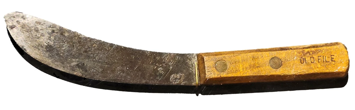 Knife has a curved blade and a wooden handle marked