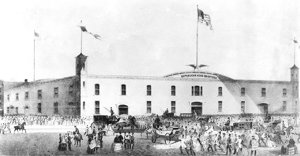 Black and white photo of a massive building with crowds outside, an eagle and flag on top, over the banner Republican Headquarters.