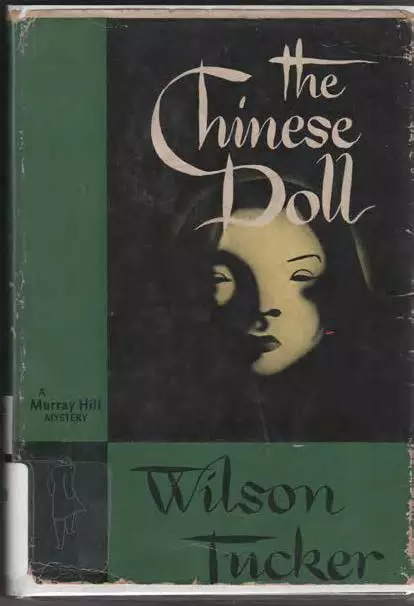 green and black book cover. In one of the black sections a porcelain face appears, heavily shadowed, a little spooky looking.